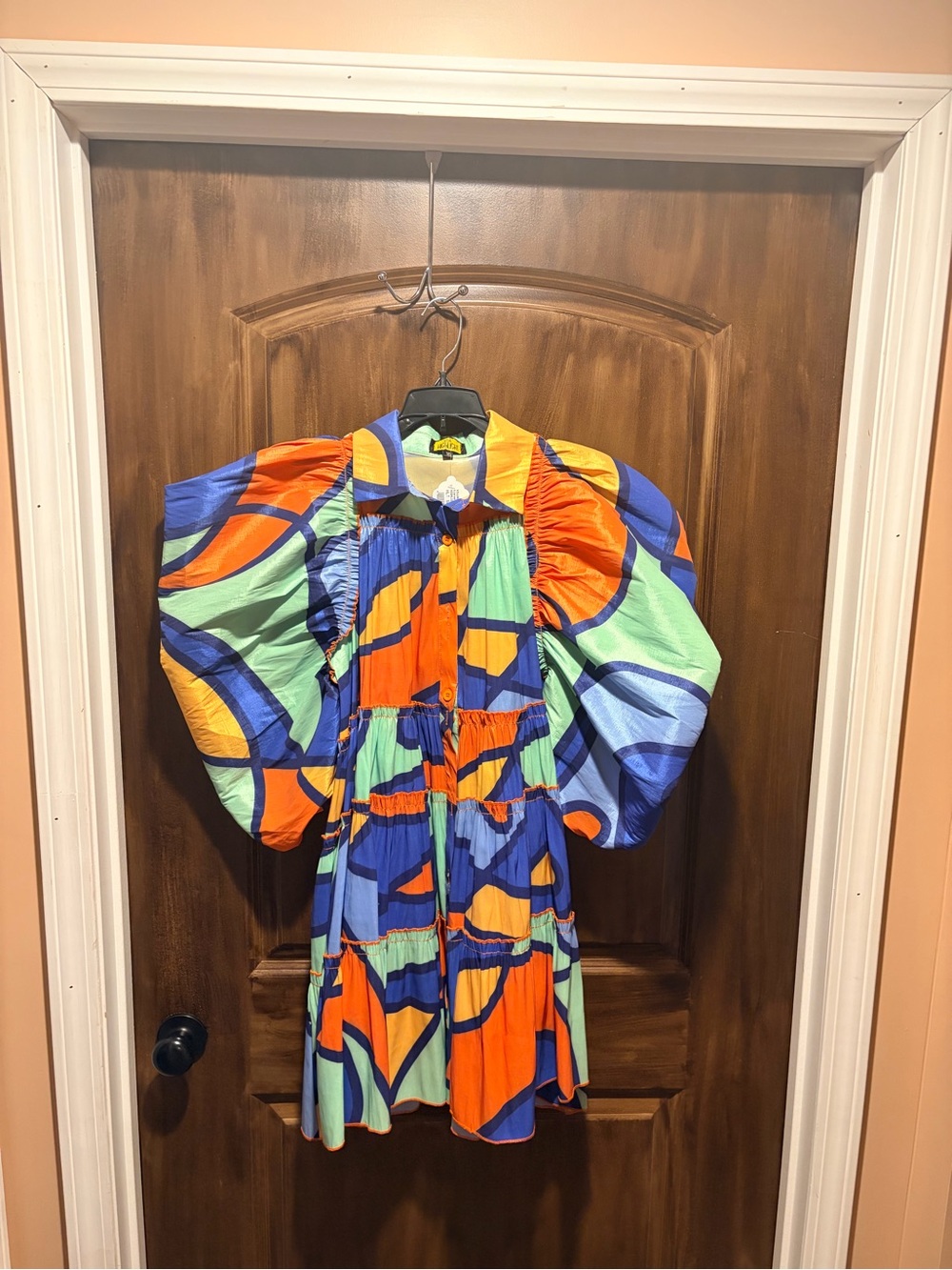 Vibrant colored puffed sleeve mini-dress.